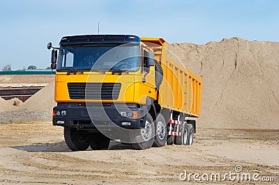 Yellow truck in the sand quarry Stock Photo