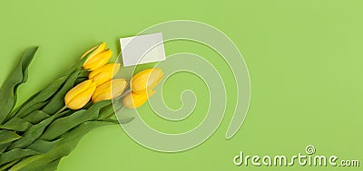 Yellow tulips bunch and empty card Stock Photo