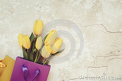 Yellow tulips in gift paper bag Stock Photo