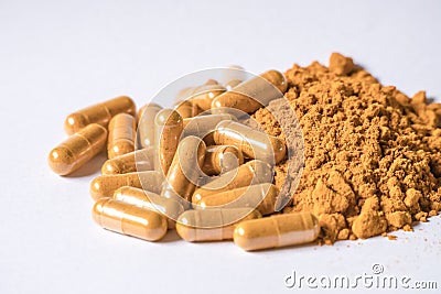 Yellow turmeric powder and turmeric capsule Stock Photo