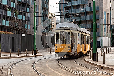 Yellow urban tram runs along the city tracks Editorial Stock Photo