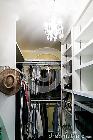 Yellow very full but organized closet in a Master bedroom Stock Photo
