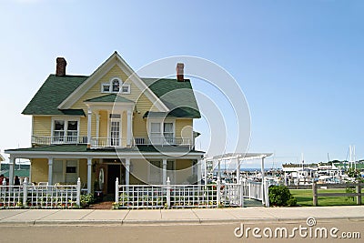 Yellow Victorian home. Stock Photo