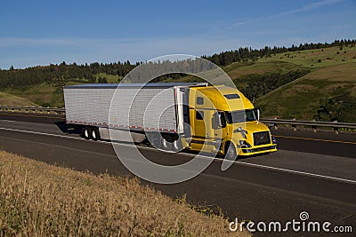 Yellow Volvo Semi-Truck / White Trailer Editorial Stock Photo