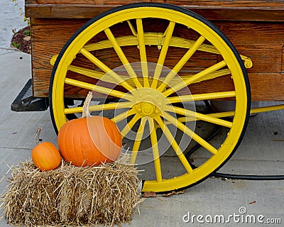 Yellow Wagon Wheel with Pumpkins Stock Photo