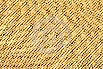 A yellow wall made of brick for background and texture. Stock Photo