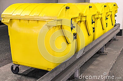 Yellow waste Containers - Recycling bin for special Rubbish Stock Photo