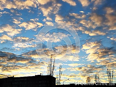 bright yellow and white clouds on blue sky Stock Photo