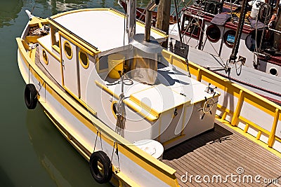 Yellow and White Fishing Boat Stock Photo