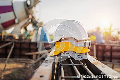 yellow and white helmet safety in construction site Stock Photo