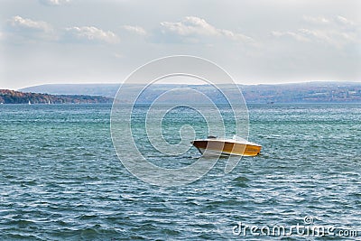 Yellow and White Motorboat on Skaneateles Lake Stock Photo