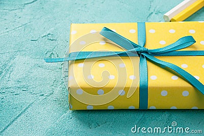 Yellow white polka dot box Stock Photo