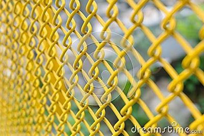 Yellow wire fence close up Stock Photo