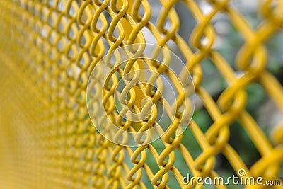 Yellow wire fence close up Stock Photo