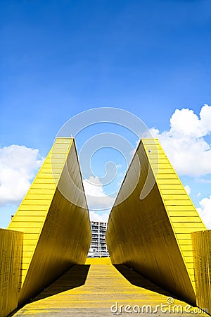 Yellow wooden gate on a beautiful day with blue sky Editorial Stock Photo