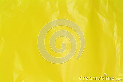 Yellow wrinkled plastic bag texture background. Stock Photo