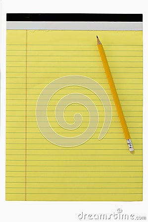 Yellow writing block with a pencil Stock Photo