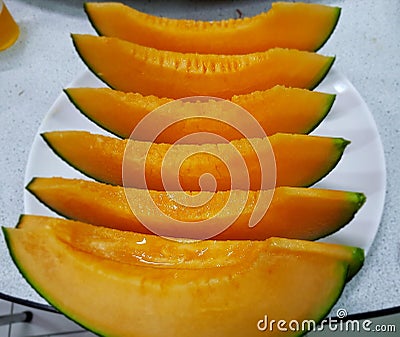 Yellowis melon handpicked by farmers Stock Photo