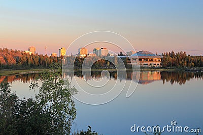 Yellowknife Skyline with Territorial Assembly Building reflected in Frame Lake in Evening Light, Northwest Territories, Canada Stock Photo