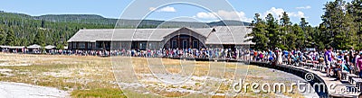 Yellowstone, Wyoming, USA, August 19, 2019, tourists gather around in front of the Yellowstone Lodge to watch the Old Faithful Editorial Stock Photo