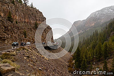 Yellowstone, Wyoming, USA, May 24, 2021: Tourist driving on the Golden Gate Viaduct on the Grand Loop Road Editorial Stock Photo