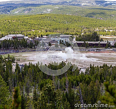 Yellowstone, Wyoming, USA, May, 25, 2021, tourists in the Upper Geyser Basin watching Old Faithful Editorial Stock Photo