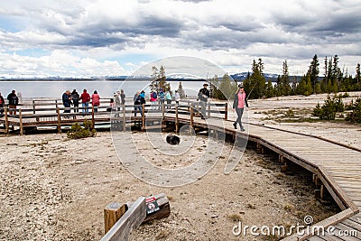 Yellowstone, Wyoming, USA, May 25, 2021: Tourists at West Thumb Geyser Basin next to Yellowstone Lake Editorial Stock Photo