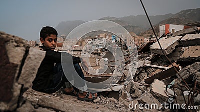 Yemeni children on the rubble of destroyed homes Editorial Stock Photo