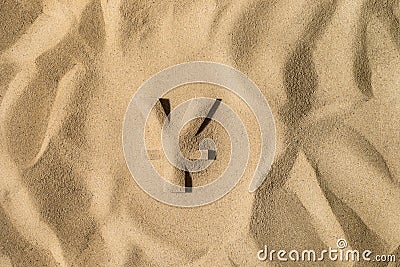 Yen Symbol Under the Sand Stock Photo