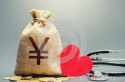 Yen Yuan money bag and stethoscope. Health life insurance financing concept. Funding healthcare system Stock Photo