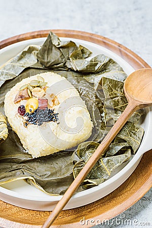 yeonnipbap, korean lotus leaf rice, Glutinous rice, dates, and chestnuts wrapped in a lotus leaf and steamed in a steamer. In the Stock Photo