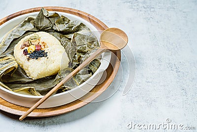 yeonnipbap, korean lotus leaf rice, Glutinous rice, dates, and chestnuts wrapped in a lotus leaf and steamed in a steamer. In the Stock Photo