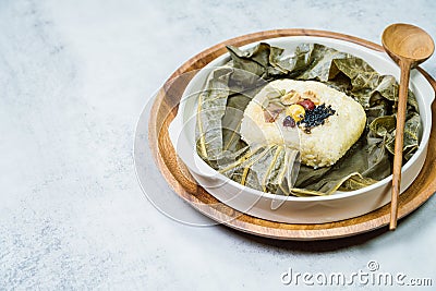 yeonnipbap, korean lotus leaf rice, Glutinous rice, dates, and chestnuts wrapped in a lotus leaf and steamed in a steamer. In the Stock Photo