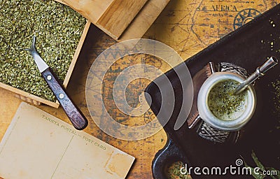 Yerba herb mate on antique map. Top View. Vintage background Stock Photo