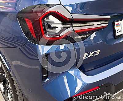 Yerevan, Armenia, June 10, 2023: Close up BMW iX3 tail light and logo. BMW iX3 with electric drive. All-electric compact SUV Editorial Stock Photo