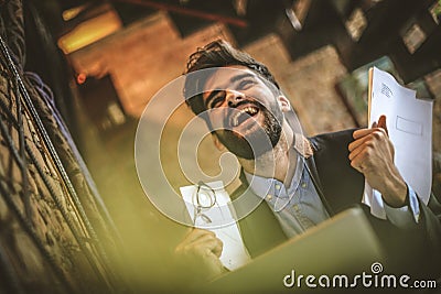Yes I did it. Young happy businessman. Stock Photo