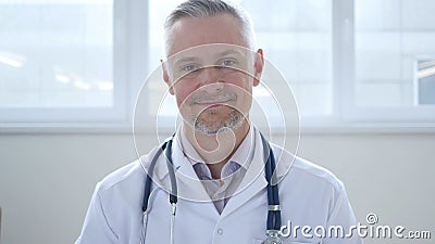 Yes, Serious Doctor Shaking Head to Agree Stock Photo