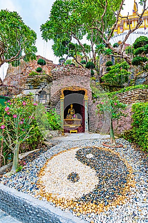 Yin Yang symbol placed in buddhist garden near the Wat Saket temple, Bangkok city, Thailand. Spiritual symbol is placed near the Stock Photo