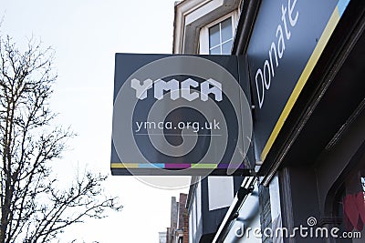 A YMCA sign outside a charity shop in Frinton, Essex in the UK Editorial Stock Photo