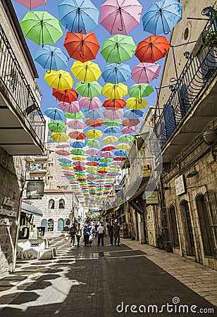 Yoel Moshe Salomon Street in Jerusalem in the historical district of Nachalat Shiva, decorated with brightly colored umbrellas Editorial Stock Photo