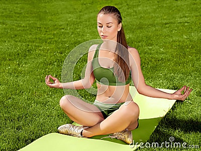 Yoga. Beautiful Woman doing Yoga Exercises Stock Photo