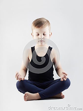 Yoga boy.child in the lotus position.children meditation and relaxation Stock Photo