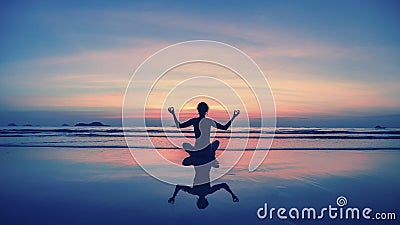 Yoga, fitness, healthy lifestyle. Silhouette meditation girl on the background of the stunning sea and sunset. Stock Photo