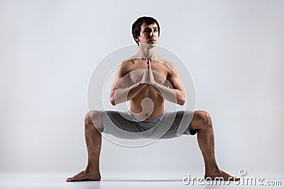 Yoga Goddess Pose (Utkata Konasana) Stock Photo