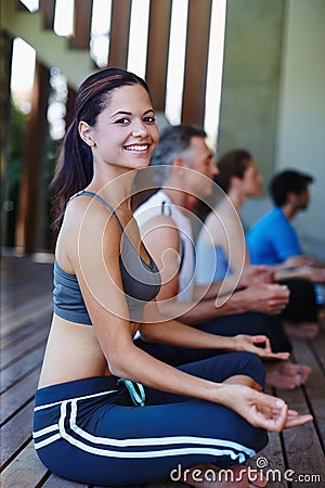 Yoga Good for the mind and the body. Portrait of a yoga class in progress. Stock Photo