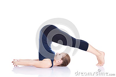 Yoga halasana plough pose Stock Photo