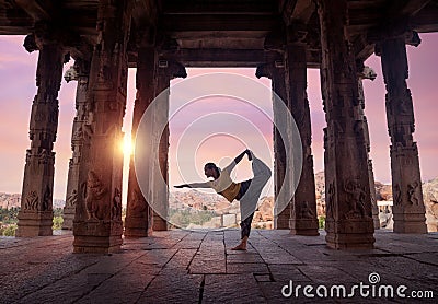 Yoga in Hampi temple Stock Photo