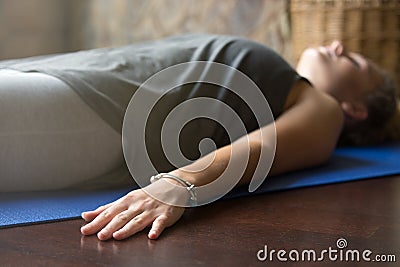 Yoga at home: Corpse Pose Stock Photo