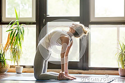 Yoga at home: Ustrasana Pose Stock Photo