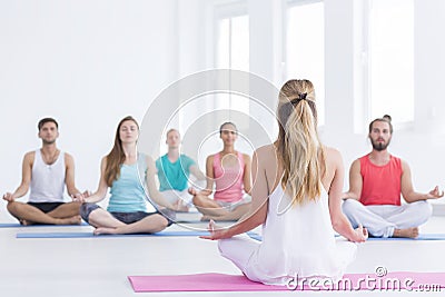 Yoga instructor in studio Stock Photo